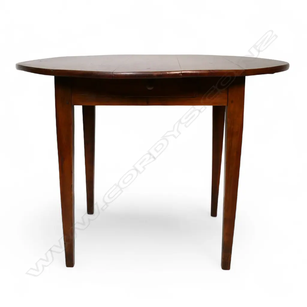 A French c.1900 fruitwood circular kitchen table, Image 1++